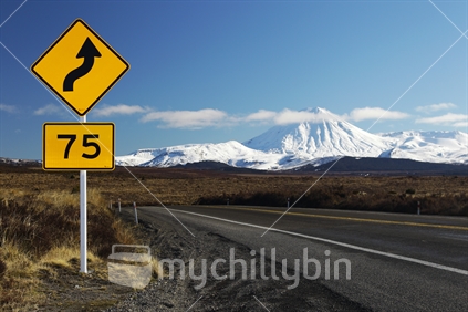 A road sign on the Desert Road, with Mt Ngauruhoe in the background.