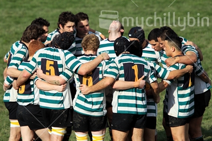 Rugby players form a huddle during a rugby game in Wellington.