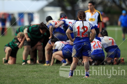 Waiting (tattoo on leg) while a scrum is formed during a women's rugby game in Wellington.