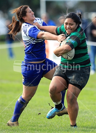 A rugby player is tackled during a women's rugby game in Wellington.