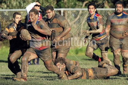 A player attempts to tackle during a rugby game in Wellington