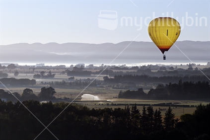 Balloons fly over Wairarapa farmland.