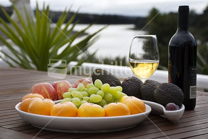 Fruit platter on deck table with a view