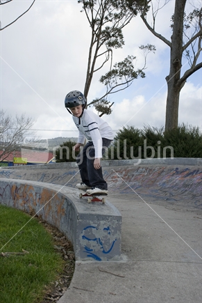 Skateboarder getting ready to jump 