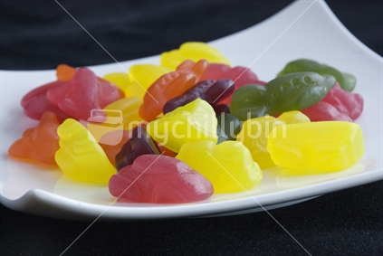 Colourful jellies on a white plate