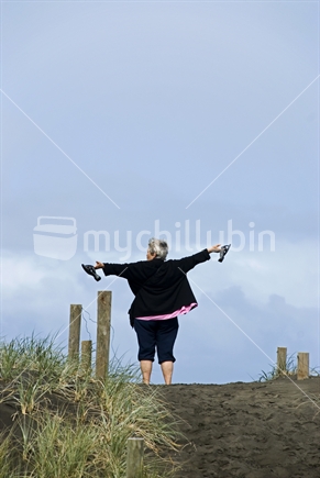 Woman enjoying the view from the sand dunes