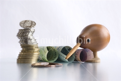 New Zealand currency and wooden kiwi bird