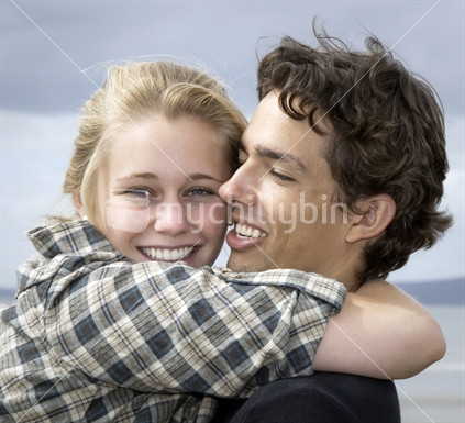 Young happy couple hugging
