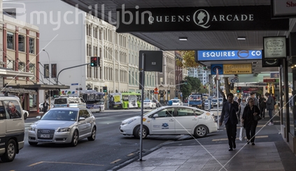 Pedestrians and cars in a hurry, Queen Street, Auckland CBD.