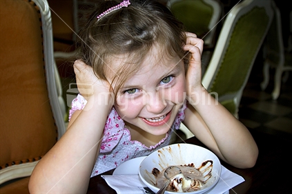 Cheeky girl eating ice cream