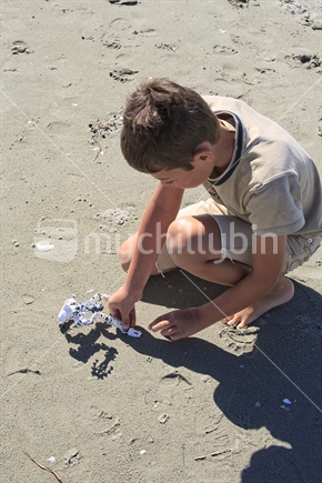 Boy playing in sand
