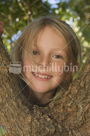 9 year old girl climbing tree 