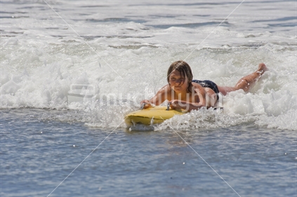 Boy playing in surf at Waimariri Beach 