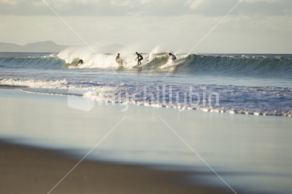 Surfers at Pakiri beach, Auckland