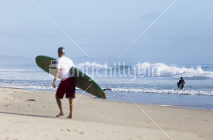 surfer at Pakiri Beach