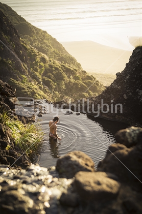 Swimming in natural pool near Piha, Auckland