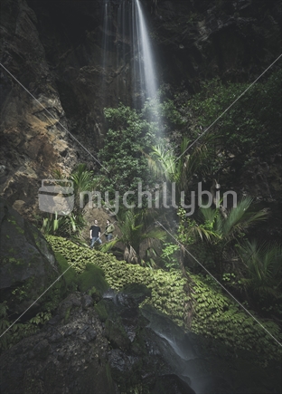 Young Couple Visiting a Secret Waterfall Auckland