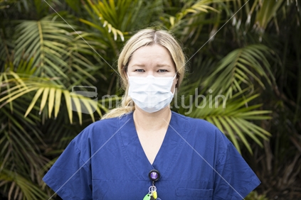 Young woman nurse wearing protective mask
