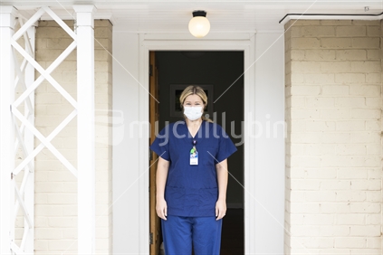 Female nurse wearing protective face mask