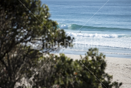 Surf beach Whangarei, Northland (Focus surfer and waves)