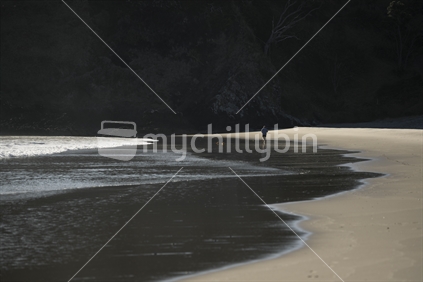 Person running along empty beach