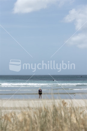 Woman (focus) on beautiful beach, Far North