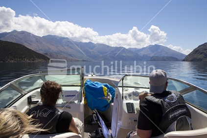 Young couple boating on Lake Wanaka