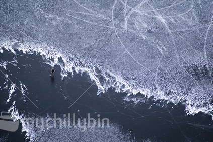 Aerial view of Diamond Lake and ice skater near Lake Wanaka