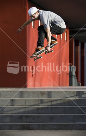 Skateboard ollie down 5 stairs