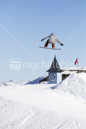 snowboarder jumping at ski field