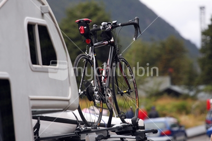 Cycle on top of support vehicle for Coast to Coast race