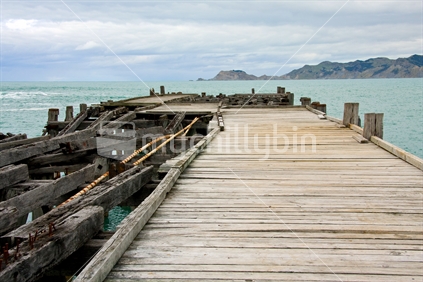 Old wooden wharf at Waima, Tokomaru Bay, East Coast, North Island, New Zealand