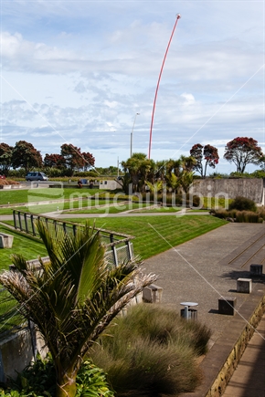 Shoreline reserve and coastal walkway, New Plymouth, Taranaki, New Zealand - with Len Lye Wind Wand sculpture in the distance. 