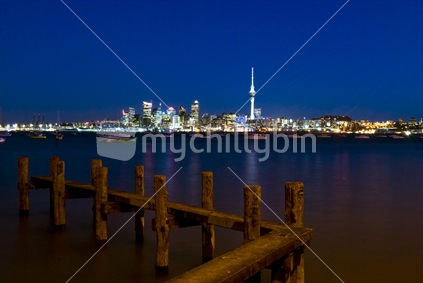 Auckland City By Night, with jetty in forefront. North Island, New Zealand