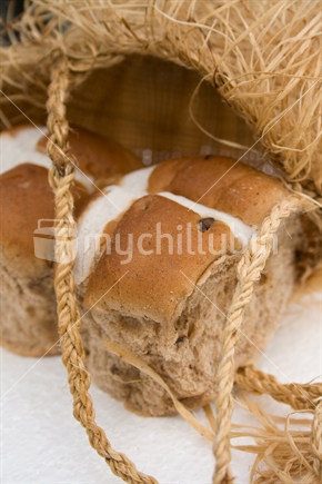 Whole hot cross buns and natural fibre bag