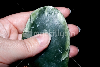 Woman's hand with greenstone