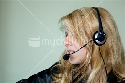 Young woman with headset, profile