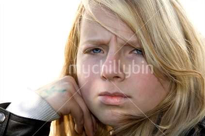Blonde teen girl, upset expression