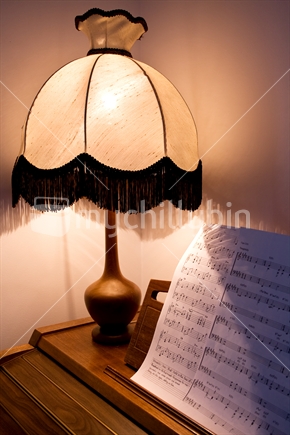 Lamp on an electric organ with sheet music
