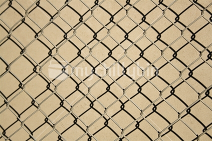 Pattern made by wire fence and it's shadow