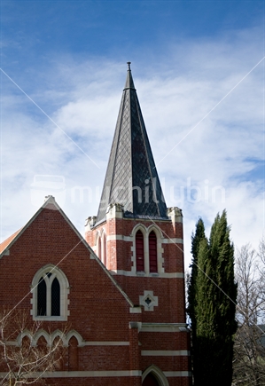 Traditional red brick church with steeple