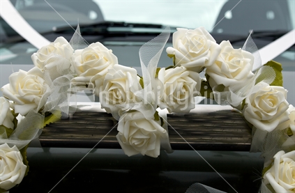 Heart-shaped wreath on a bridal car