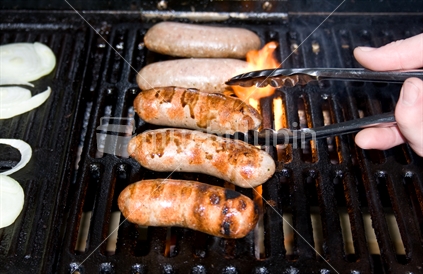 Cooking sausages on a bbq