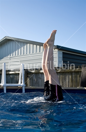 Handstand in a swimming pool