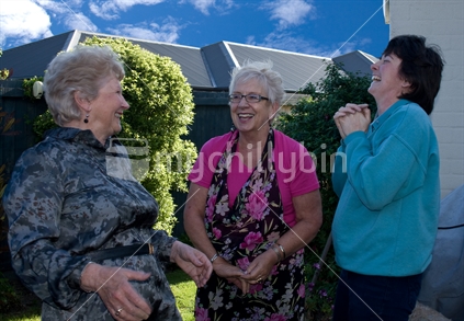 3 New Zealand woman (mixed ages) having a fun conversation outdoors.
(The 3rd Model release is covered under other images subbed with this upload batch)