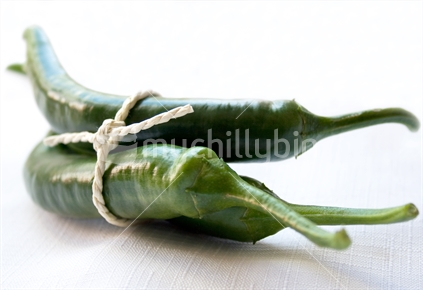 Three green chillies tied in a bundle