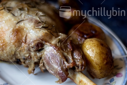 Homestyle roasted leg of lamb and potatoes (soft focus)