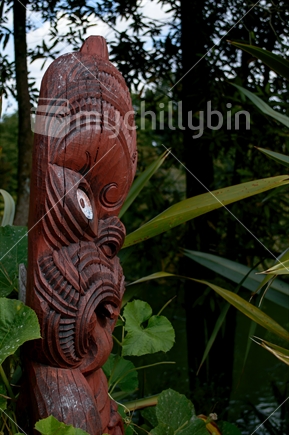 Maori carved figure beside Waikato River