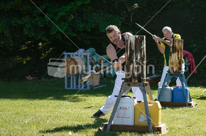 Competitors in a wood chopping event
