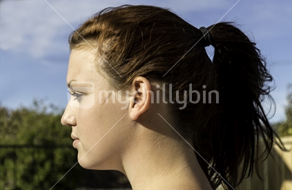 Young brunette woman with pony tail